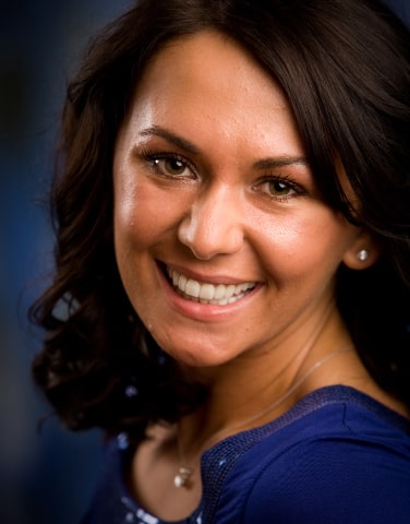 patient of Excellence in Dentistry showing on the benefits of cosmetic dentistry